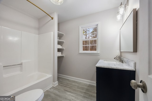 full bathroom featuring vanity, wood-type flooring, shower / tub combination, and toilet