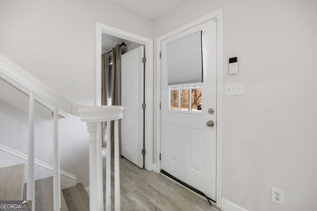 entryway with light hardwood / wood-style flooring