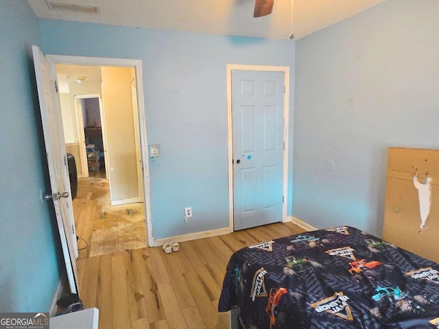 bedroom with wood-type flooring