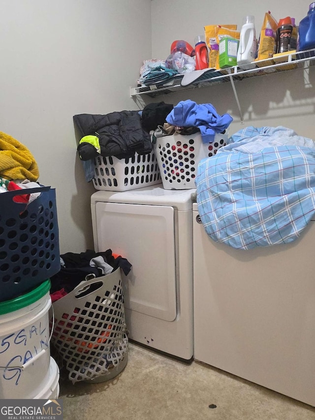 clothes washing area with independent washer and dryer