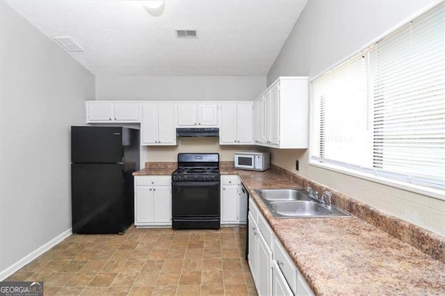 kitchen with white cabinetry, sink, and black appliances