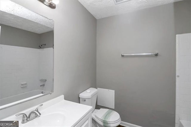 full bathroom featuring vanity, shower / bathing tub combination, a textured ceiling, and toilet