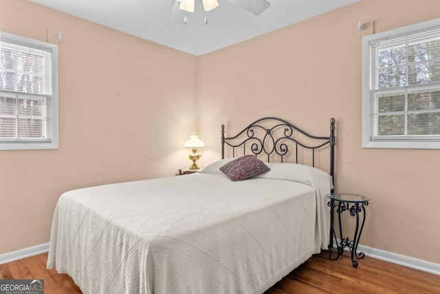 bedroom featuring wood-type flooring and ceiling fan