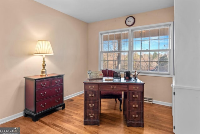 home office with light wood-type flooring