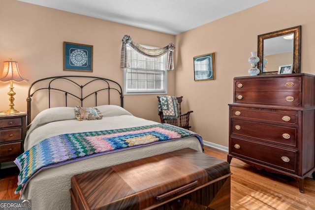 bedroom with light hardwood / wood-style flooring