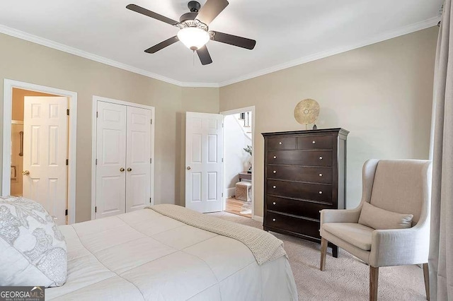 bedroom featuring crown molding, light colored carpet, a closet, and ceiling fan