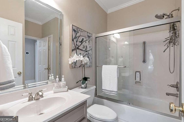 full bathroom with ornamental molding, toilet, combined bath / shower with glass door, and vanity