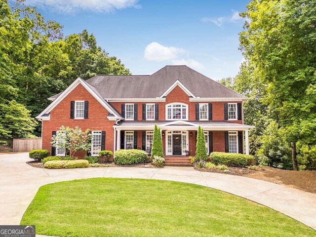 colonial home with a front yard