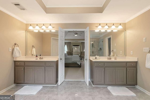 bathroom with crown molding, tile patterned floors, vanity, and ceiling fan