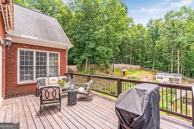 deck featuring an outdoor living space and grilling area