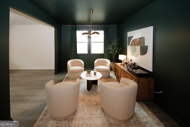 living area with wood finished floors and baseboards