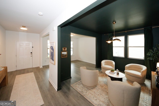 interior space featuring wood finished floors and baseboards