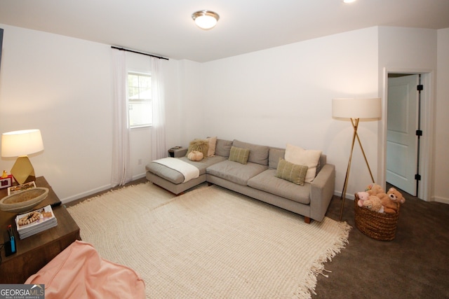 carpeted living room with baseboards