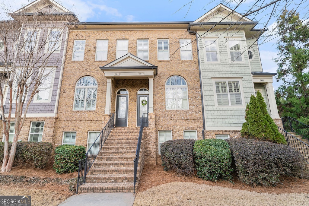 multi unit property featuring brick siding