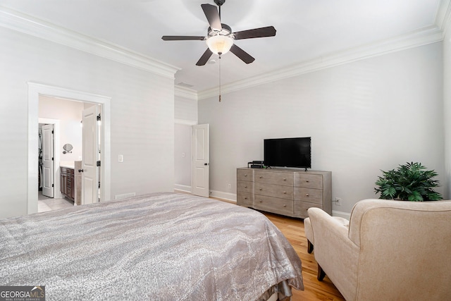 bedroom with crown molding, ceiling fan, ensuite bathroom, and light wood-type flooring