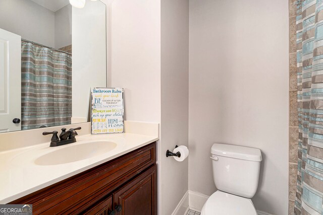 bathroom with vanity and toilet