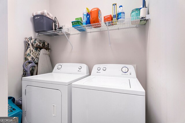 washroom featuring washing machine and dryer