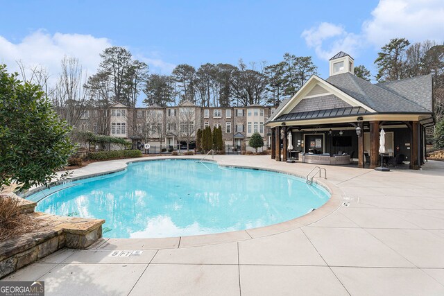 view of pool featuring a patio area