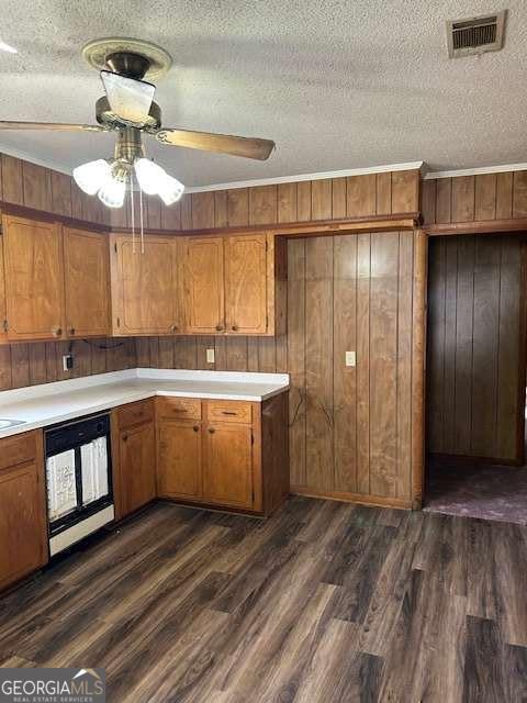 kitchen with dark hardwood / wood-style flooring, ceiling fan, a textured ceiling, and black dishwasher