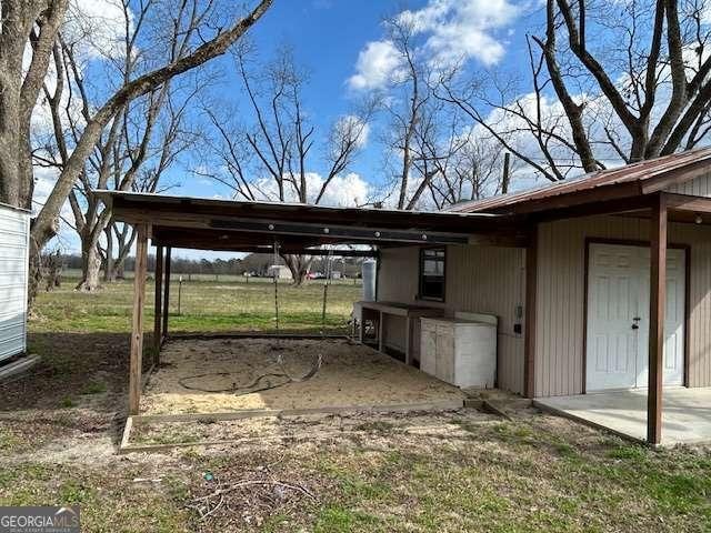 view of car parking with a carport