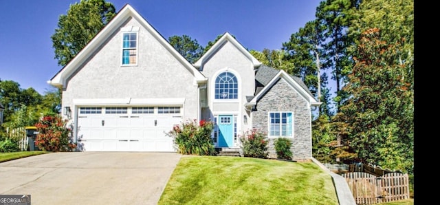 view of front facade featuring a garage and a front lawn