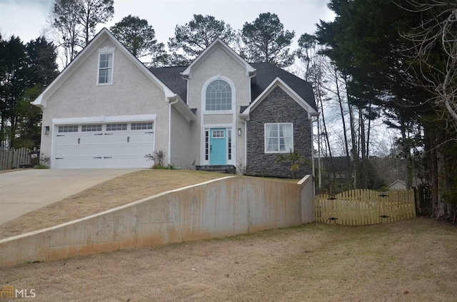 view of front property featuring a garage and a front yard