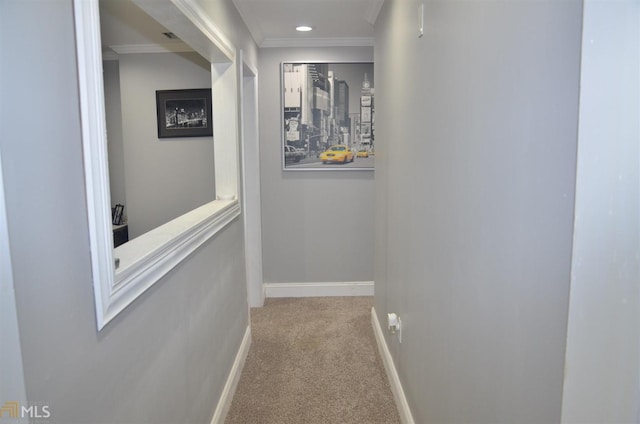 hallway with light carpet and crown molding