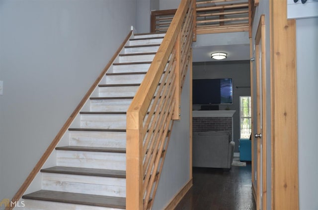 stairway featuring hardwood / wood-style floors