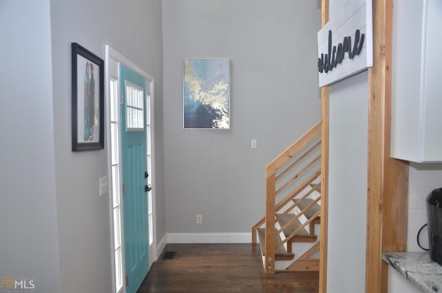 foyer entrance with dark hardwood / wood-style flooring