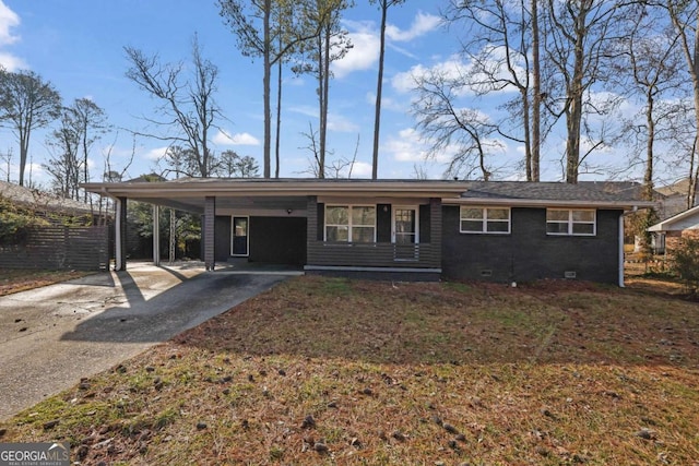 single story home featuring a carport