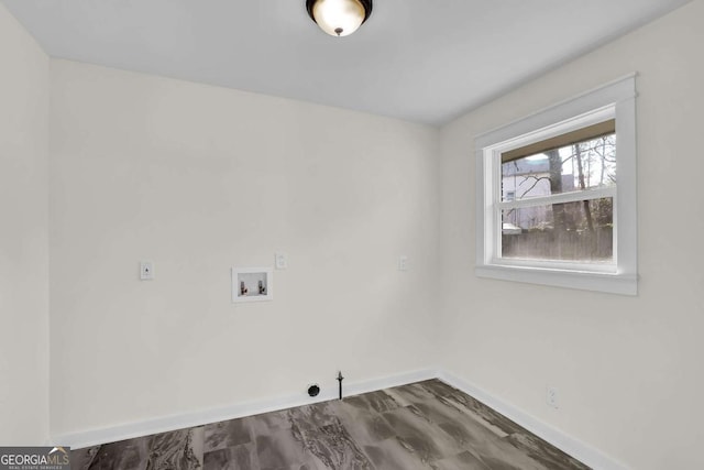 washroom featuring washer hookup, dark hardwood / wood-style flooring, and gas dryer hookup