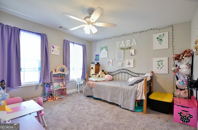 carpeted bedroom with ceiling fan