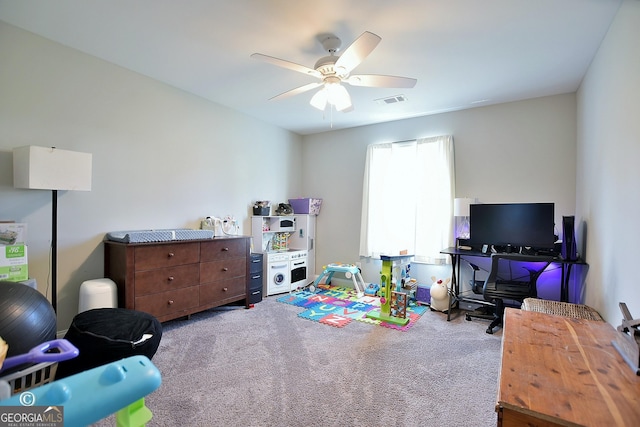 interior space with ceiling fan and carpet