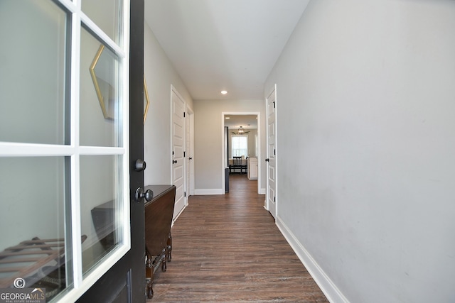 hallway featuring dark wood-type flooring