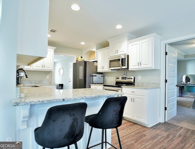 kitchen featuring white cabinetry, sink, and stainless steel appliances