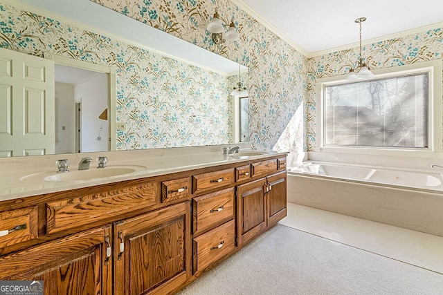 bathroom with vanity, ornamental molding, and a bath