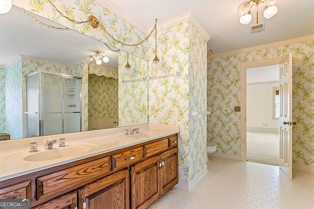 bathroom with vanity, ornamental molding, a shower with shower door, tile patterned floors, and toilet