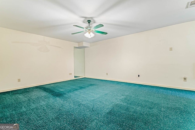 carpeted spare room featuring ceiling fan