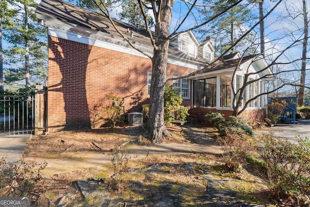 view of home's exterior featuring a sunroom