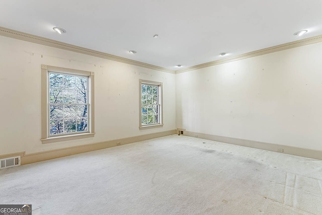 carpeted empty room featuring ornamental molding