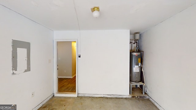 interior space with electric panel and water heater