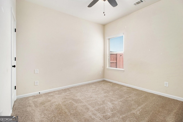 unfurnished room featuring carpet flooring and ceiling fan