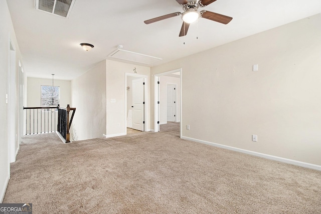 empty room featuring light carpet