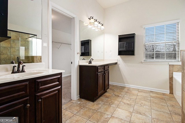 bathroom with vanity, tile patterned floors, and separate shower and tub