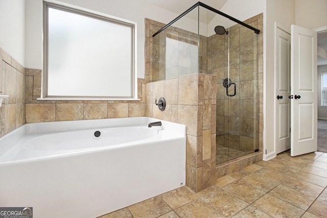 bathroom featuring plus walk in shower