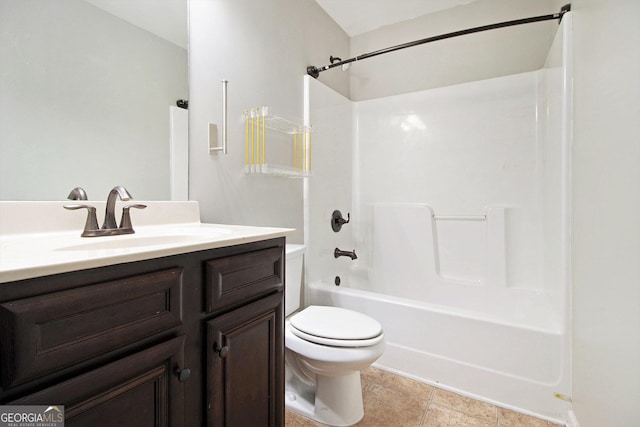 full bathroom featuring vanity, toilet,  shower combination, and tile patterned flooring