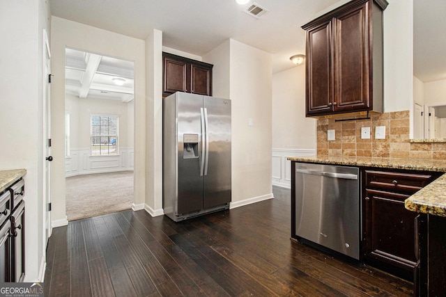 kitchen featuring stainless steel appliances, dark hardwood / wood-style floors, light stone counters, coffered ceiling, and dark brown cabinetry