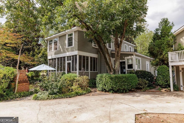 view of front of property with a sunroom