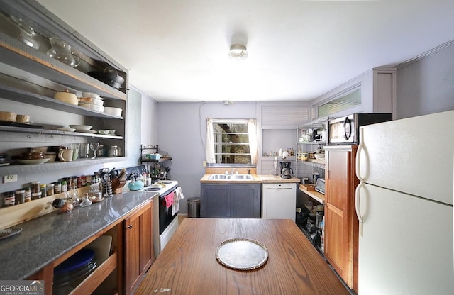 kitchen with sink and white appliances