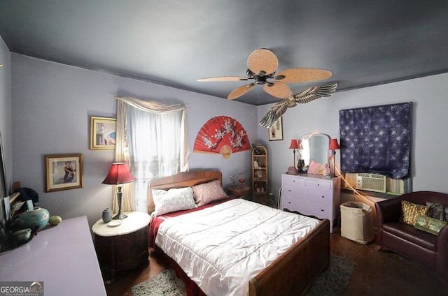 bedroom with cooling unit, dark wood-type flooring, and ceiling fan